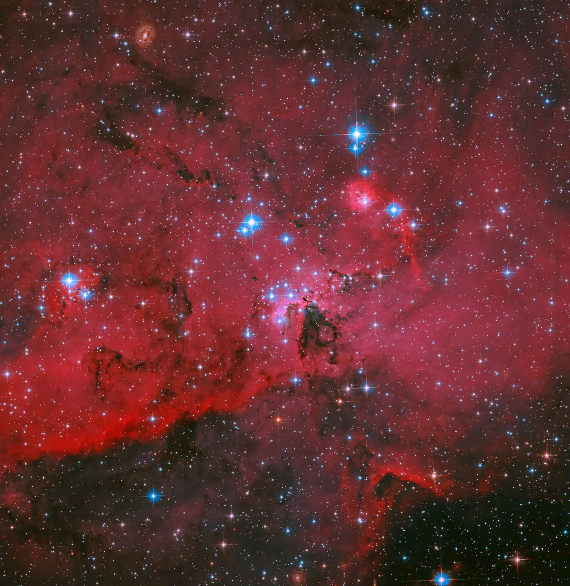 Hubble, Büyük Macellan Bulutu'nda kızıl bir yıldız beşiğini görüntüledi