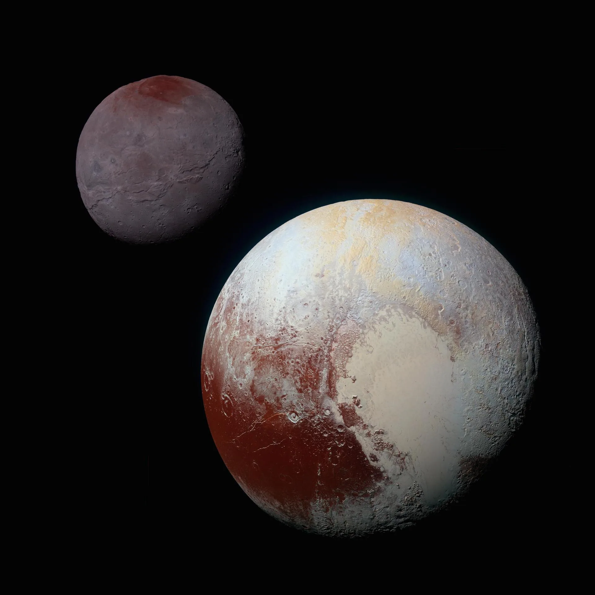 NASA'nın New Horizons aracının 14 Temmuz 2015'teki geçişinde görüntülediği Plüton ve uydusu Charon